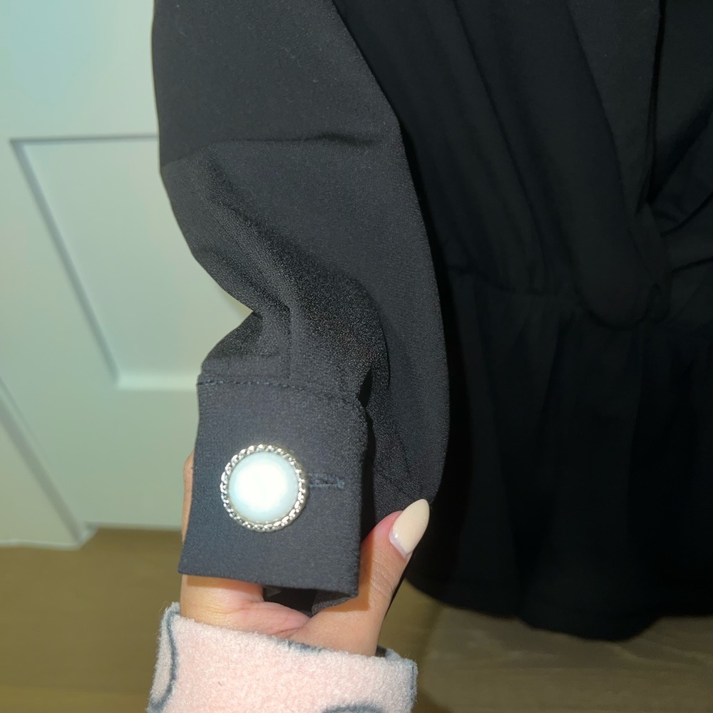 Black jumpsuit, size small with pearls on the sleeves